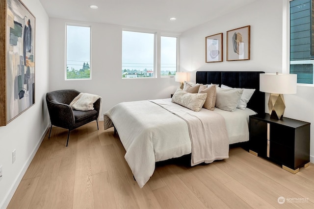 bedroom with light hardwood / wood-style floors