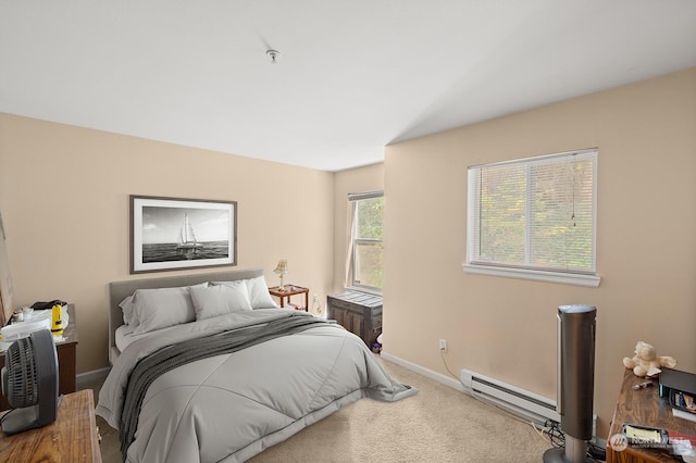 bedroom with carpet flooring and baseboard heating