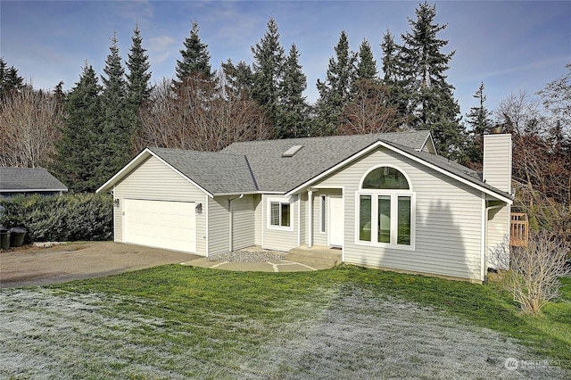 single story home featuring a garage and a front yard