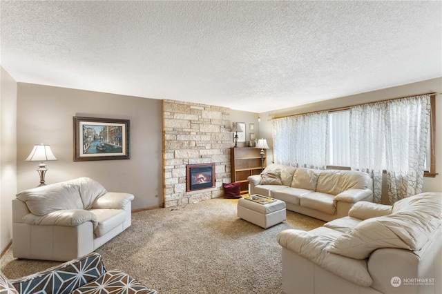 living room featuring a fireplace, a textured ceiling, and carpet