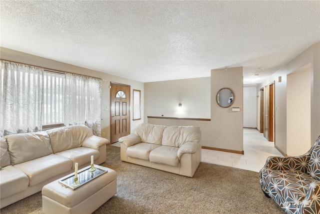 carpeted living room featuring a textured ceiling