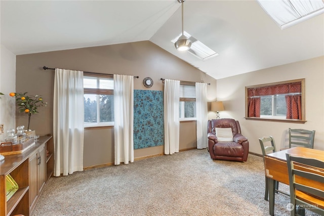 living area featuring lofted ceiling and light colored carpet