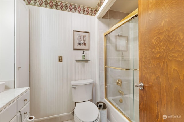 full bathroom featuring bath / shower combo with glass door, vanity, and toilet