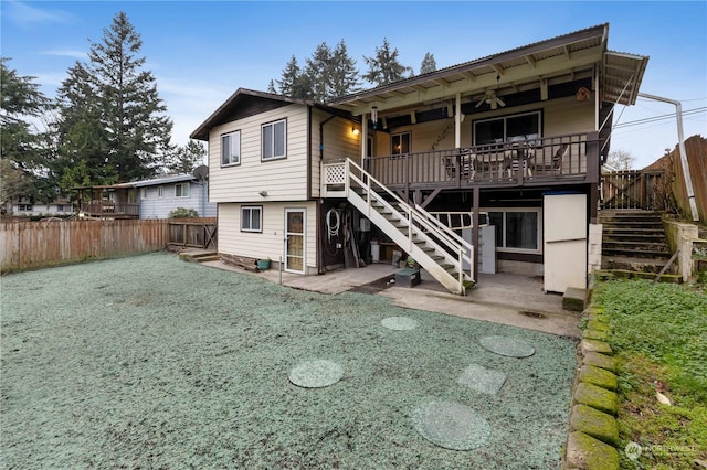 back of house with a patio