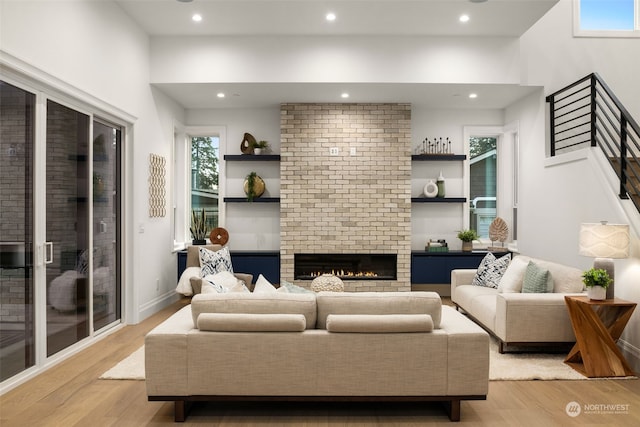 living room featuring a fireplace and light hardwood / wood-style flooring