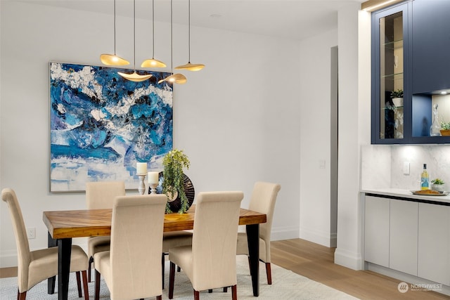 dining room with light wood-type flooring