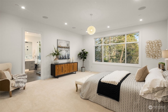 carpeted bedroom with ensuite bathroom