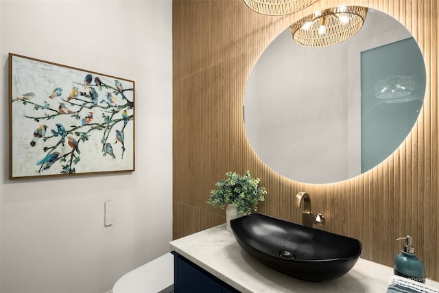 bathroom featuring vanity and a notable chandelier