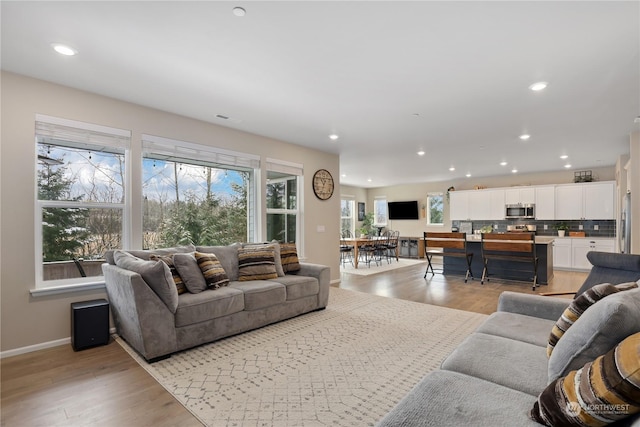 living room featuring light wood-type flooring