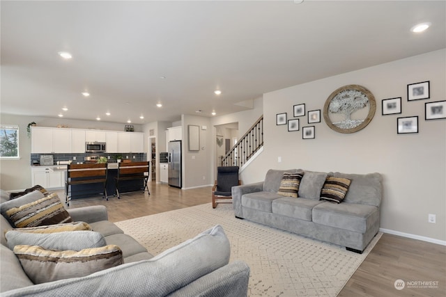 living room with light hardwood / wood-style flooring