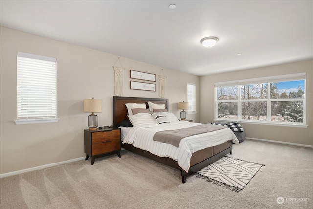 bedroom with light colored carpet