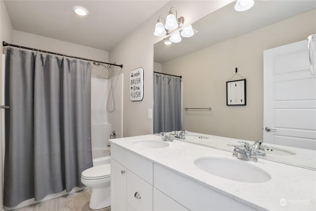 full bathroom featuring vanity, toilet, and shower / bath combo