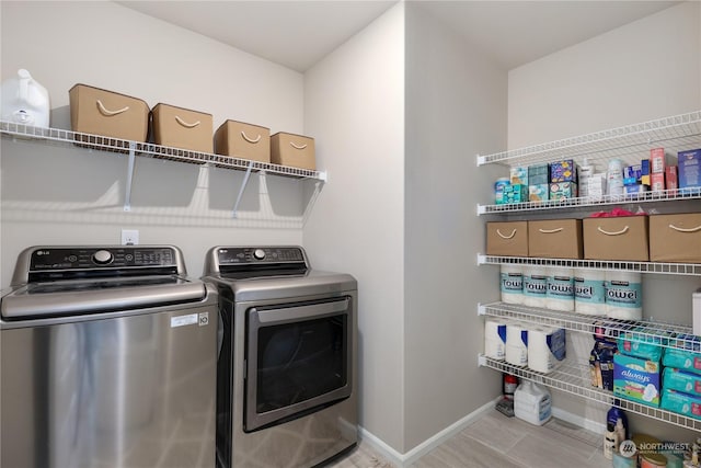 washroom with separate washer and dryer