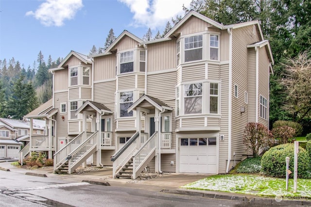 multi unit property featuring a garage