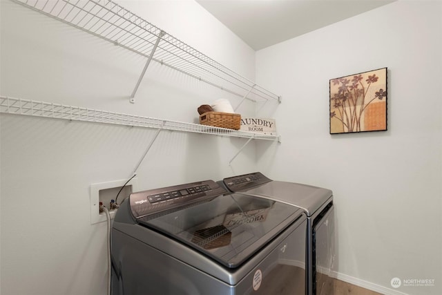 laundry room with washing machine and clothes dryer