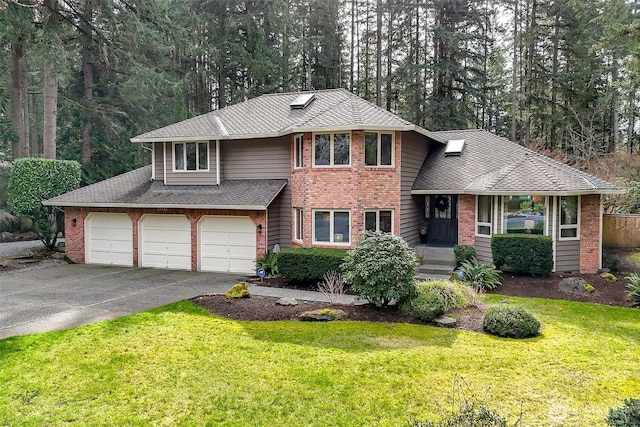 view of front of home with brick siding, driveway, an attached garage, and a front yard