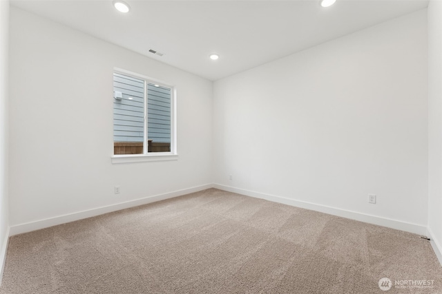 carpeted empty room with baseboards, recessed lighting, and visible vents
