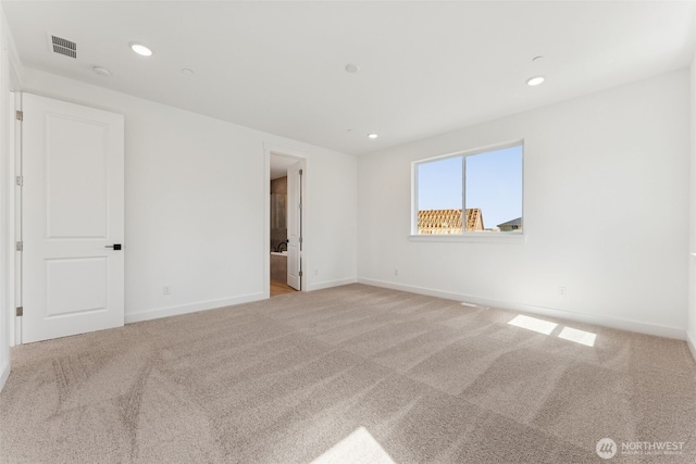 empty room with recessed lighting, baseboards, visible vents, and light carpet