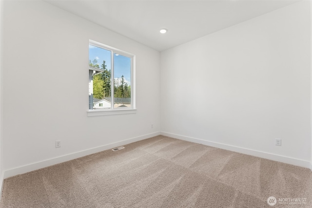 unfurnished room featuring baseboards, visible vents, recessed lighting, and light colored carpet