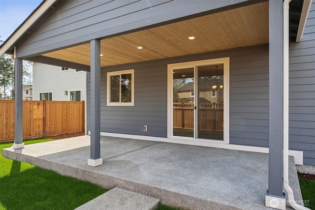 view of patio / terrace featuring fence