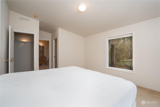 carpeted bedroom with vaulted ceiling