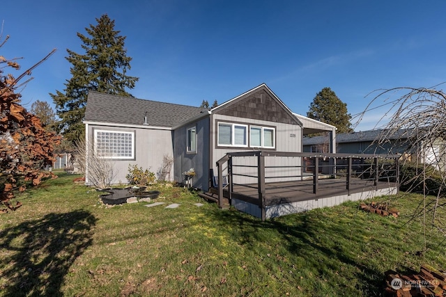 back of house with a lawn