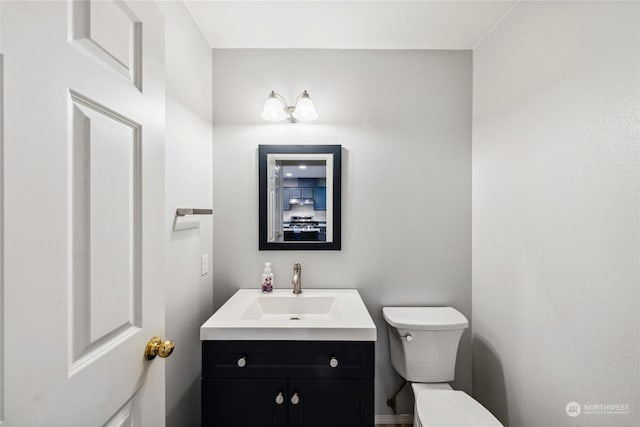 bathroom with vanity and toilet