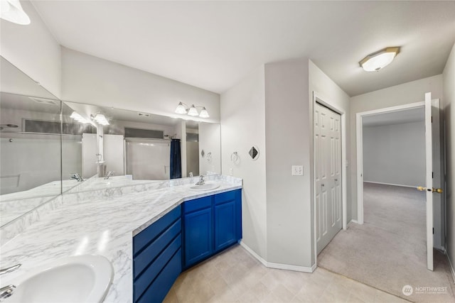 bathroom featuring vanity and curtained shower