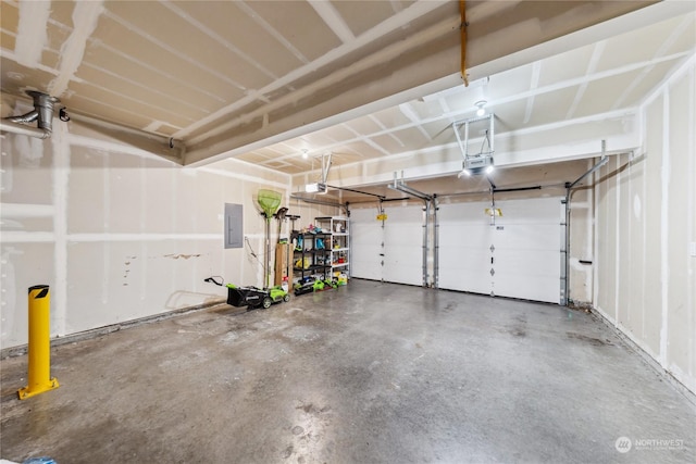 garage featuring electric panel and a garage door opener