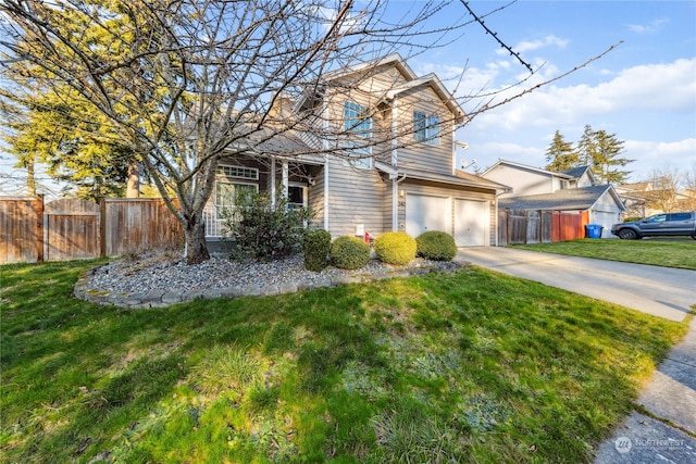 front of property featuring a garage and a front yard