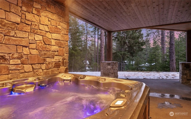 exterior space with sink, a jacuzzi, and wooden ceiling