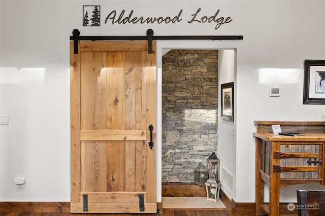 interior space featuring a barn door