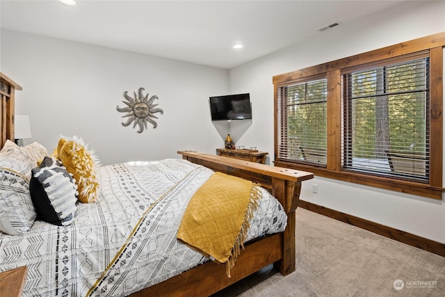 bedroom with light carpet