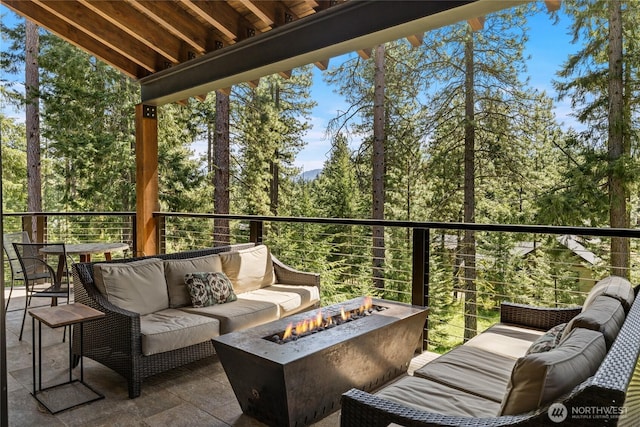 60 Birch Ct, Cle Elum, WA 98922 - balcony featuring an outdoor living space with a fire pit and a wooded view
