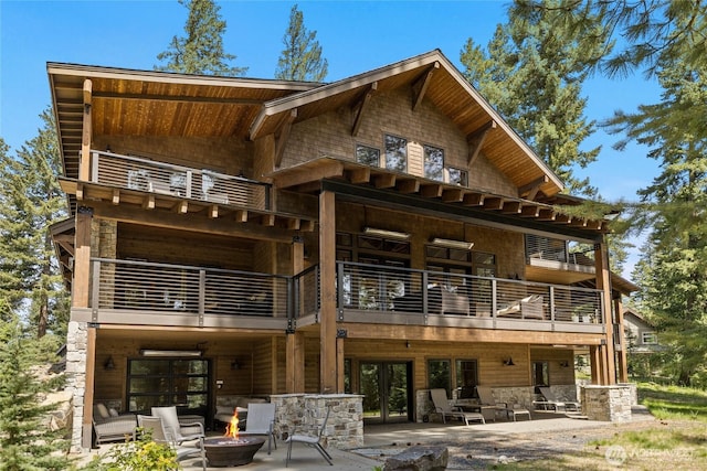 60 Birch Ct, Cle Elum, WA 98922 - rear view of house featuring a balcony, a fire pit, a patio, and french doors