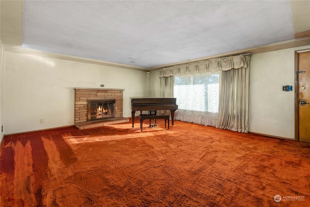 unfurnished living room with a stone fireplace, a textured ceiling, and carpet flooring