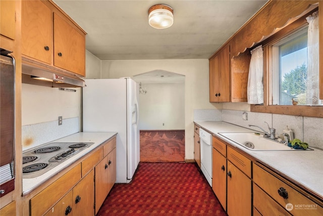 kitchen with sink and white appliances