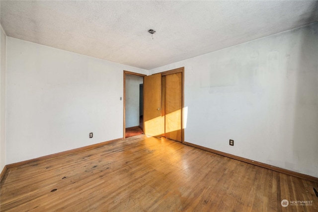 spare room with light wood-type flooring