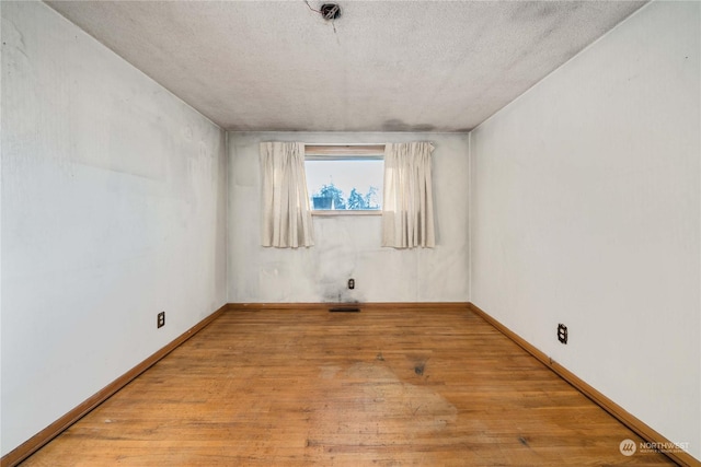 empty room with light hardwood / wood-style floors