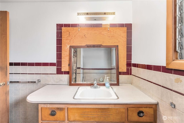 bathroom featuring tile walls and vanity