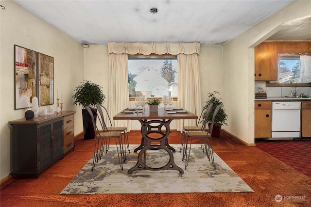 dining space with dark carpet