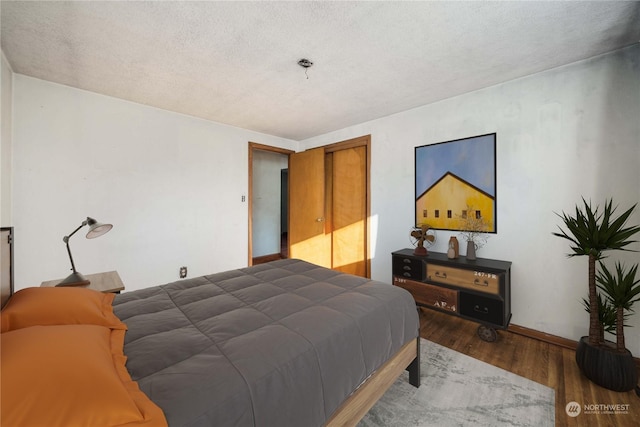 bedroom with hardwood / wood-style floors