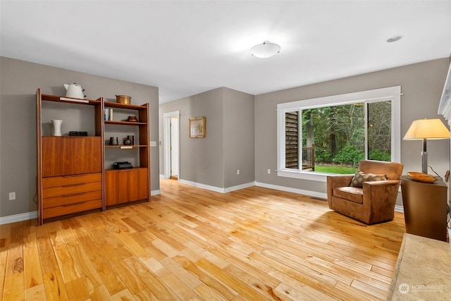 sitting room with light hardwood / wood-style flooring