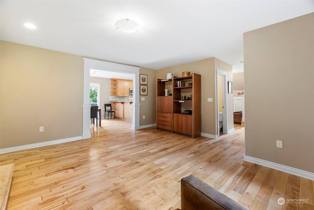 unfurnished living room with light hardwood / wood-style floors