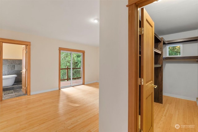 corridor featuring light hardwood / wood-style floors