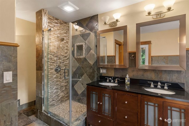 bathroom featuring vanity and a shower with shower door