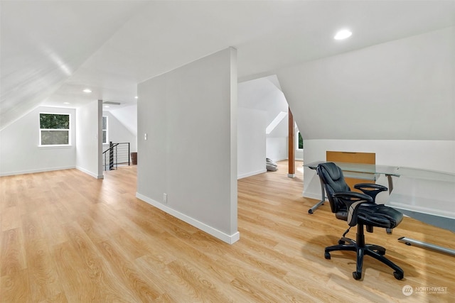 office area featuring light wood-type flooring and lofted ceiling