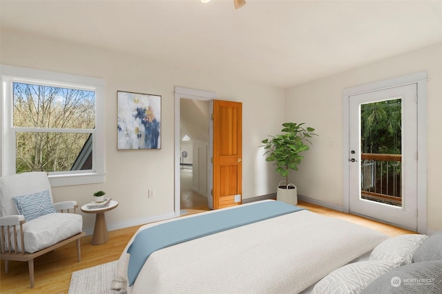 bedroom with light hardwood / wood-style flooring and access to outside