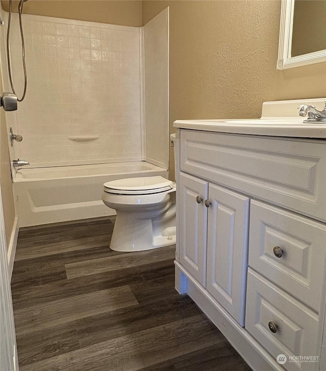 full bathroom featuring shower / bathtub combination, wood-type flooring, toilet, and vanity