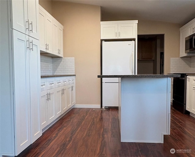 kitchen with white cabinetry, a center island, tasteful backsplash, and electric range oven